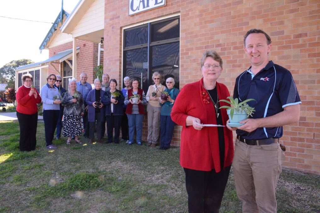 Big donation: Project coordinator Pam Eyb presented Taree PCYC's Justin Hayes with a cheque alongside Taree Craft Cottage members. Photo: Scott Calvin. 