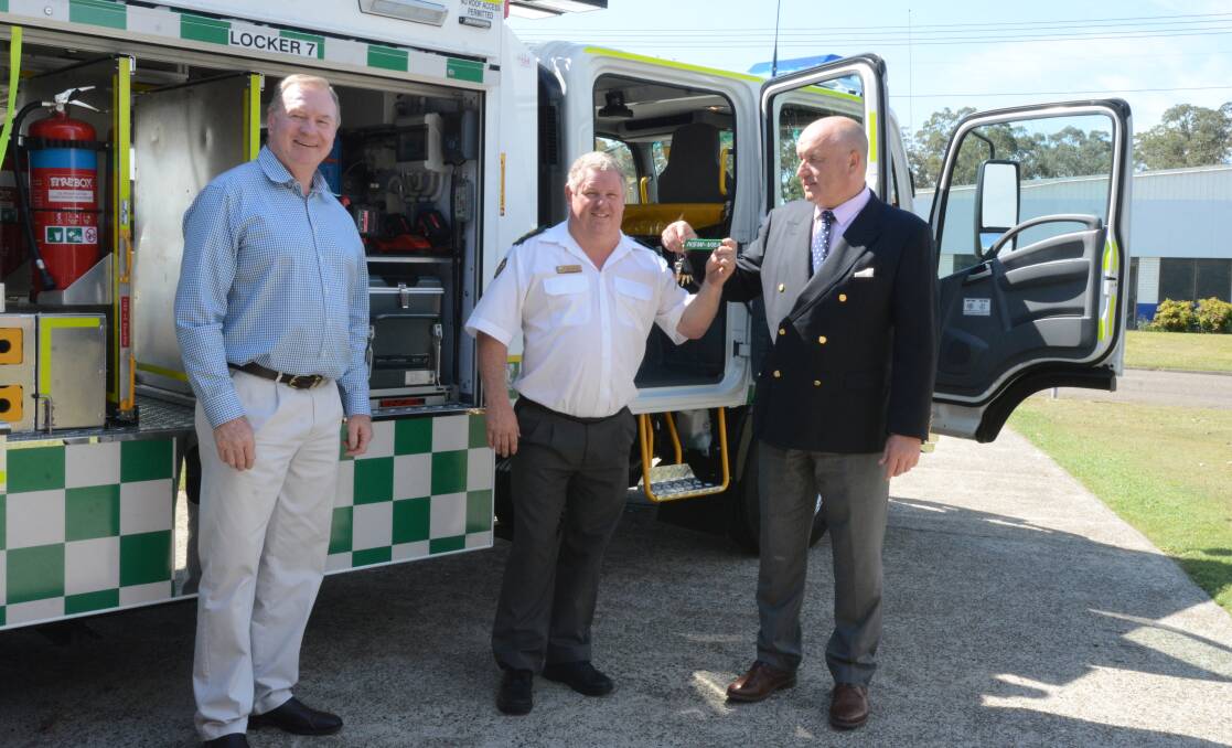 Taree Rescue Squad captain Allan Sheldon was handed the keys by Member for Myall Lakes Stephen Bromhead and NSW Emergency Services Minister David Elliott. Photo: Scott Calvin.