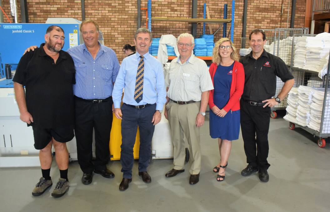 Valley Linen employee Alan Campbell, Valley Industries CEO Trent Jennison, Lyne MP Dr David Gillespie, deputy chairman Don Phillips, human resources officer Renee Gilbert and social enterprises manager Rob Gander on the floor of Valley Linen. Photo: Rob Douglas.