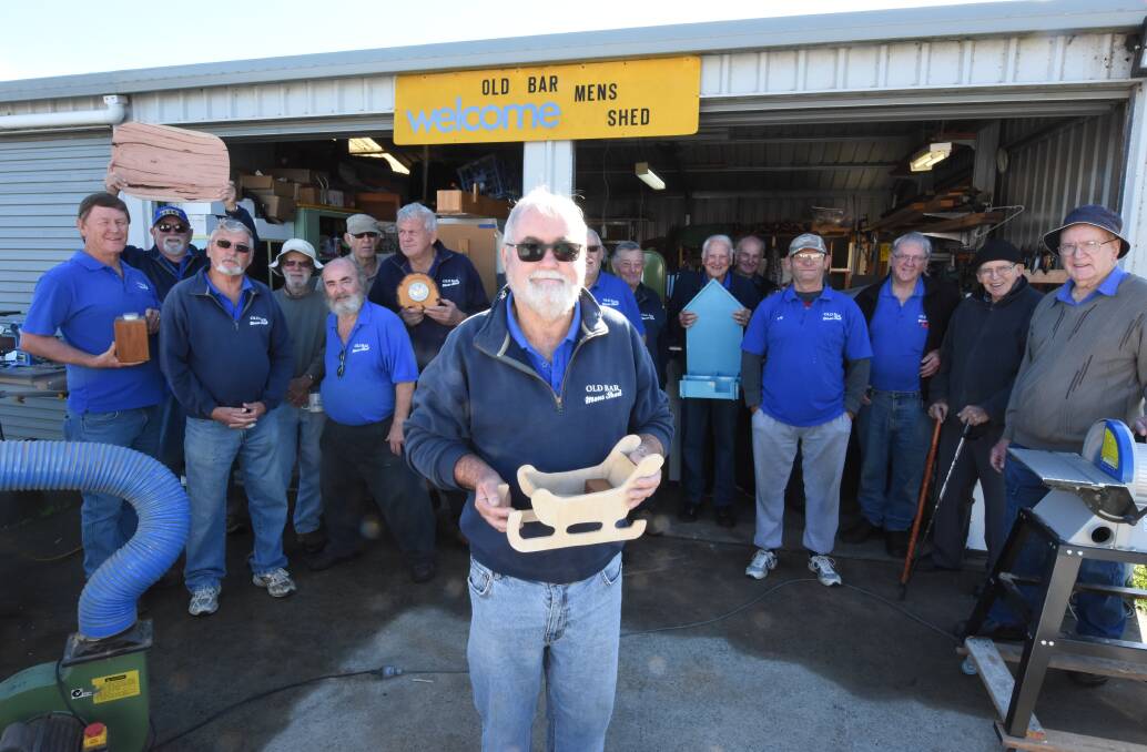 Old Bar Men's Shed president David Denning with members of the group. The group will eventually move to EG Trad Fields. Photo: Scott Calvin. 