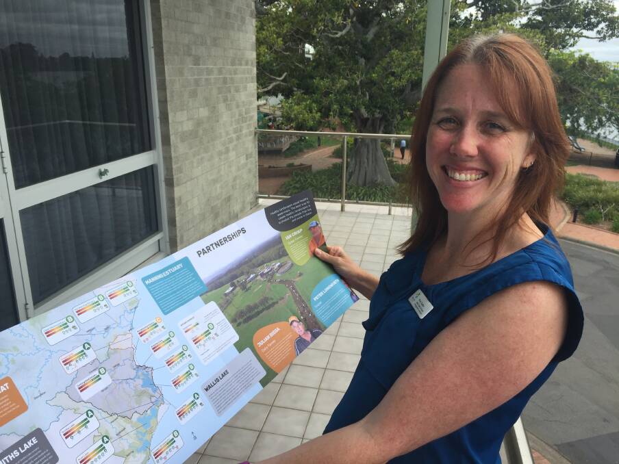 MidCoast Council's water quality and estuary management coordinator Prue Tucker with a copy of the report card.