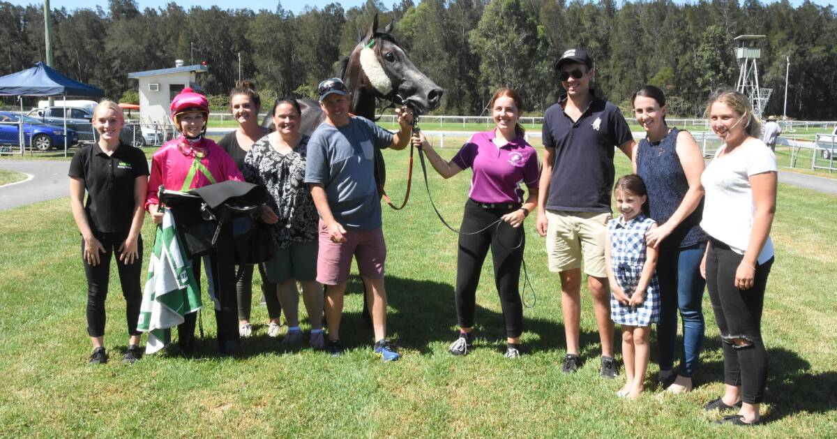 Winning team: Jockey Louise Day and trainer Wayne Wilkes celebrate with family and friends after Subtle Grey won the Wingham Beef Exports Sat 6 April Class 2 Handicap at Sunday's meeting in Taree. Photo: Scott Calvin. 