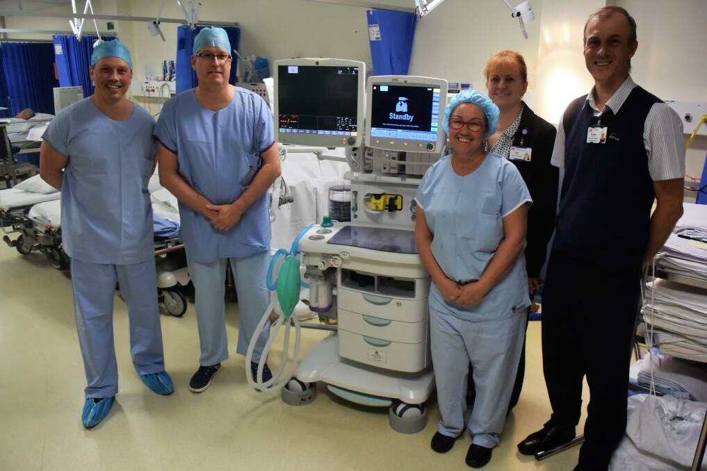 Much needed equipment: GE Health Care's Simon Cresswell, Dr Stefan Lang, Manning Hospital general manager Jodi Nieass, anaesthetics coordinator Toni Davis and nurse unit manager Michael De Wright with one of the new machines.