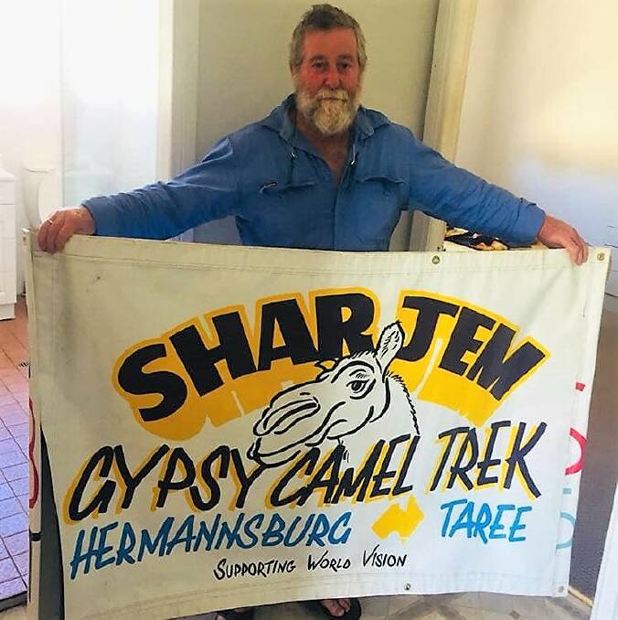 Barry Watts with the promotional banner for the trek. Photo: supplied.