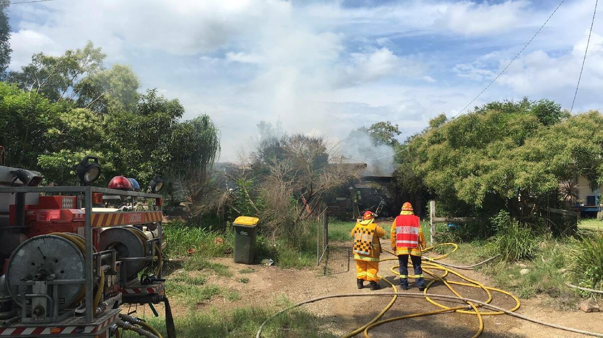Crews bring a house fire under control at Lansdowne. Photo: NSW Rural Fire Service Mid Coast District.