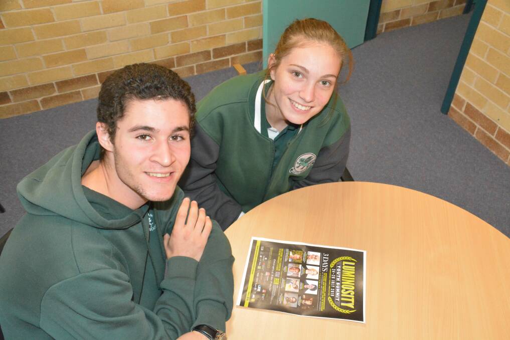Chatham High School students Zachary Walton and Macy James check out the run sheet for Port Macquarie's Luminosity Summit. Photo: Jodie Bird.
