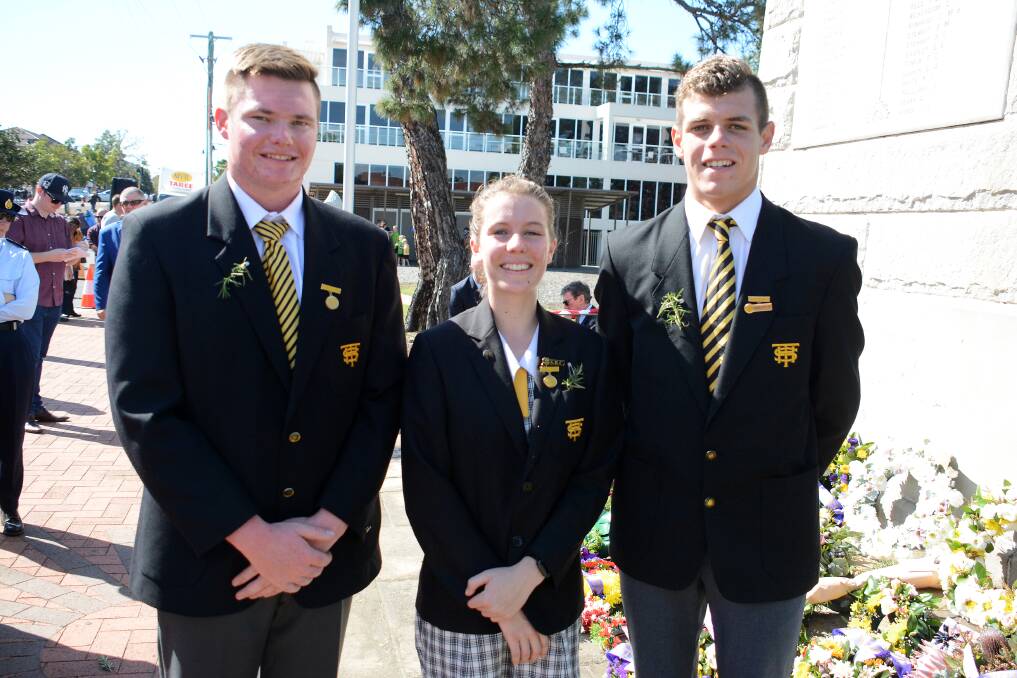 Taree High School captains Lucas Kloosterhof and Amber Kelleher and Bevan Smith at the Taree Anzac Day service. Photo: Scott Calvin.