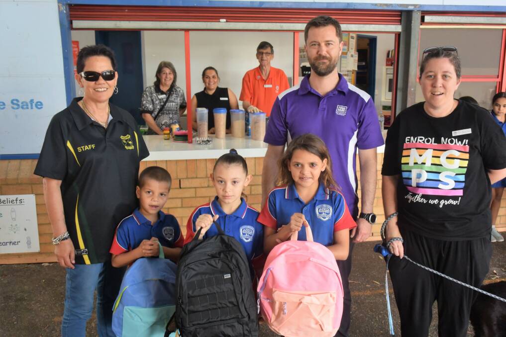 Thoughtful gesture: Marayong Public School donated backpacks and stationary to Manning Gardens Public School. Photo: Rob Douglas.