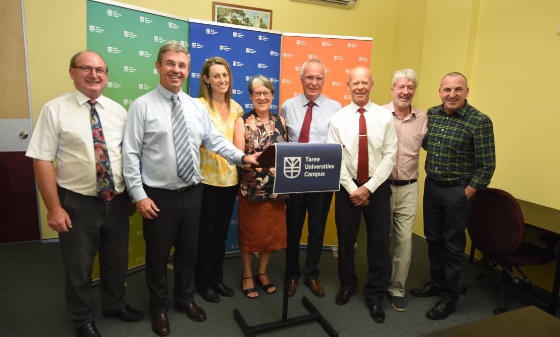 Appointed: TUC board members Maurie Stack, Dr John Howard, Lisa Proctor, Alison McIntosh, Steve Atkins and Graham Brown with Member for Lyne Dr David Gillespie and MidCoast Council mayor David West. Photo: Scott Calvin