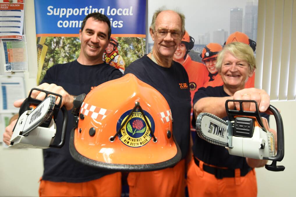 Come along: Taree City SES unit's Glenn Laycock, Andrew Esson and Helen Crittenden invites the public to the open day on Saturday. Photo: Scott Calvin. 