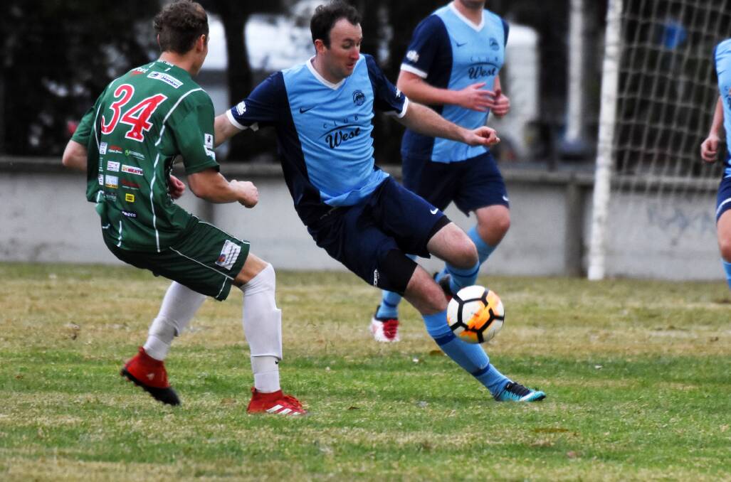 On the ball: Ricky Campbell in action for the Wildcats against Kempsey last weekend. No football will be played over the long weekend. Photo: Scott Calvin.