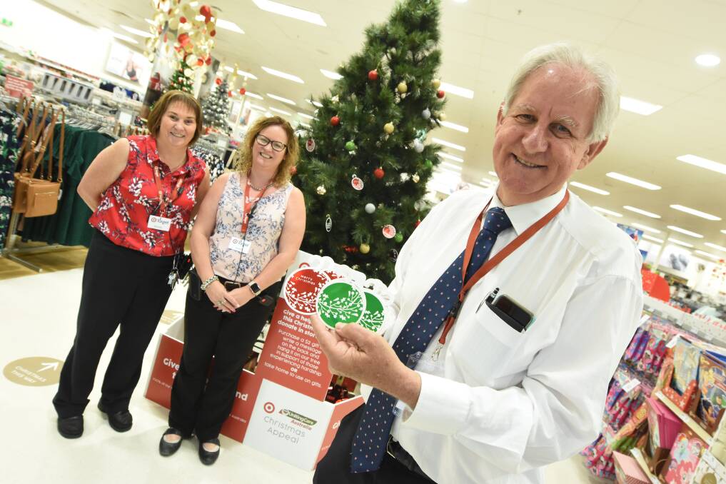 Target Taree department manager Megan West, store manager Kerry Fischer and Taree Uniting Care representative Pastor David Freeman at the launch of the Christmas appeal. Photo: Scott Calvin