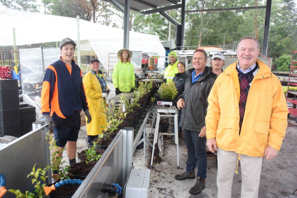 Member for Myall Lakes Stephen Bromhead with Parkland Nursery staff. The business purchased a potting machine with a State government grant to start getting production back up to speed. Photo: Rob Douglas.