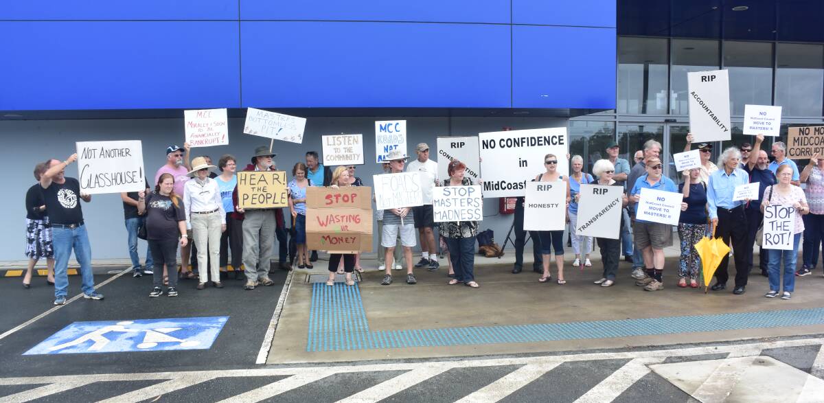 Residents protested outside the former Masters site before MidCoast Council's development application was approved by the Hunter Central Coast Regional Planning Panel.