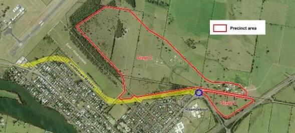 The transport hub precinct area (outlined in red), the planned location for the roundabout (blue circle) and proposed Cundletown Bypass (yellow). Photo taken from MidCoast Council's Northern Gateway report.