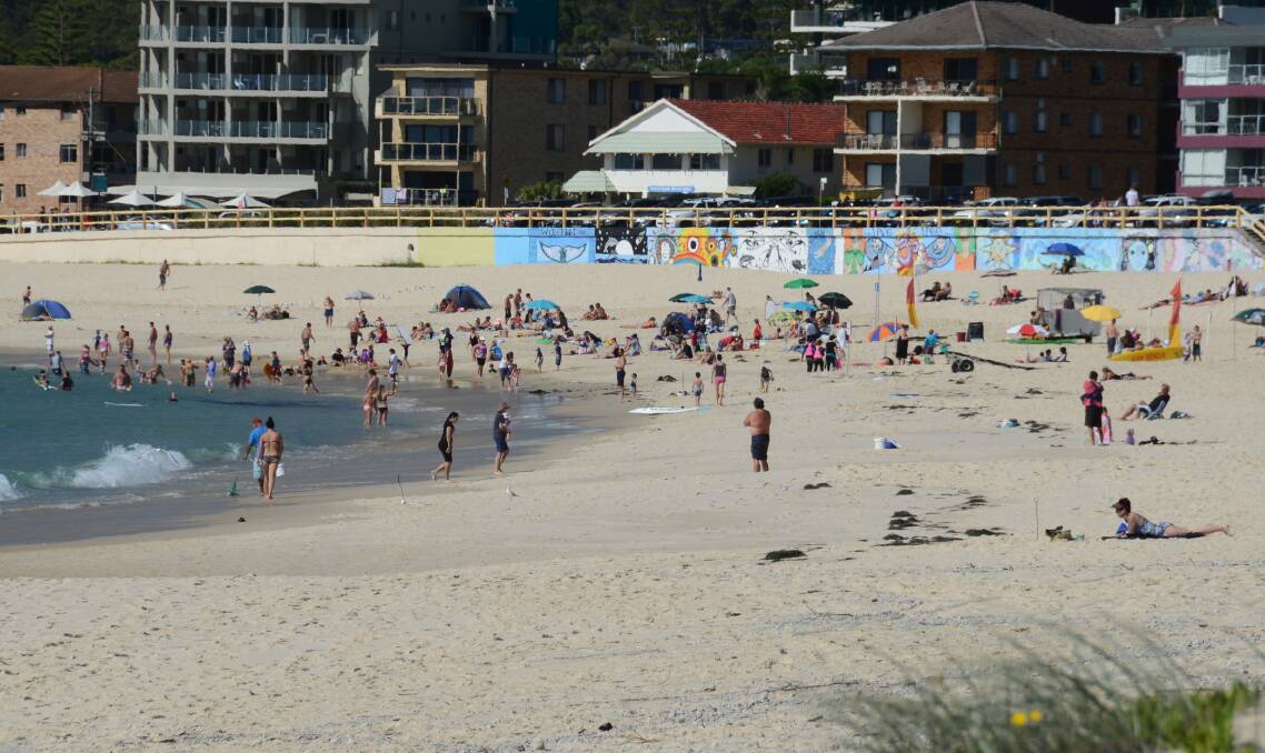 A packed Forster Main Beach during summer.