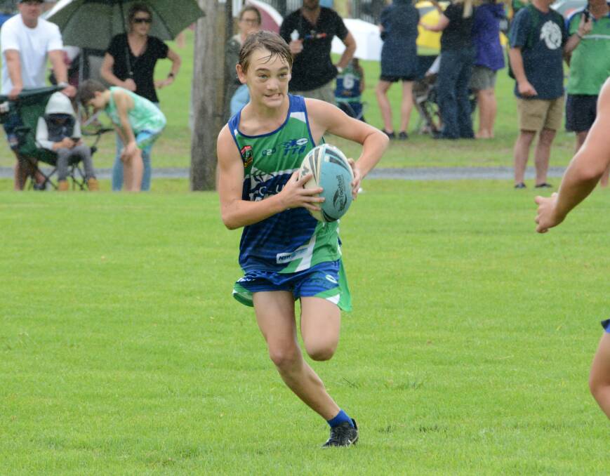 Aaron Merchant charges into space for the Taree under 14s at the Northern Eagles junior titles in Tuncurry last month. Taree Touch will field 10 sides in the Junior State Cup northern conference this weekend.