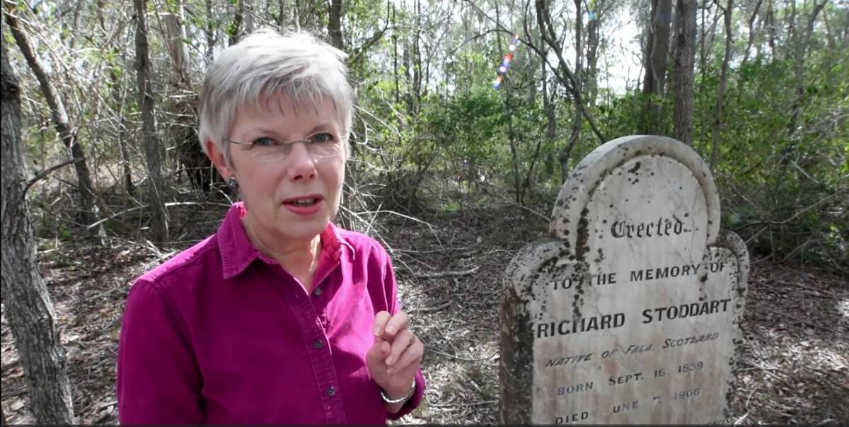 MidCoast Stories' Penny Teerman at Richard Stoddart's grave in Woola Woola Cemetery. 