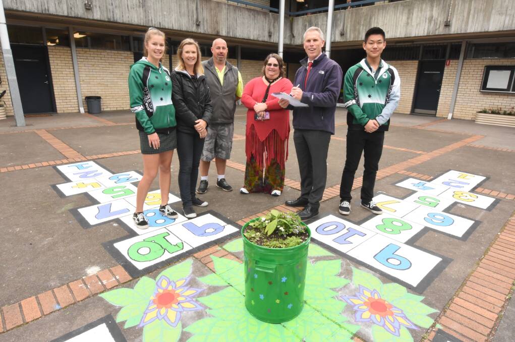 A work of art: Teagan Phillips, Robyn Phillips, Dale Patterson, Maree Ruprecht-Cooper, principal Daryl Irvine and Stanley Tan. Photo: Scott Calvin. 