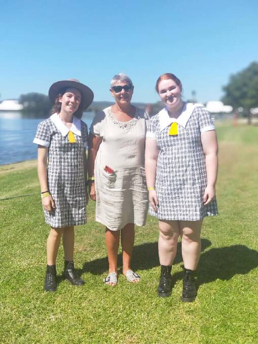 Amber Kelleher and Sasha Fordham with school principal Allison Alliston at the Taree Australia Day function.