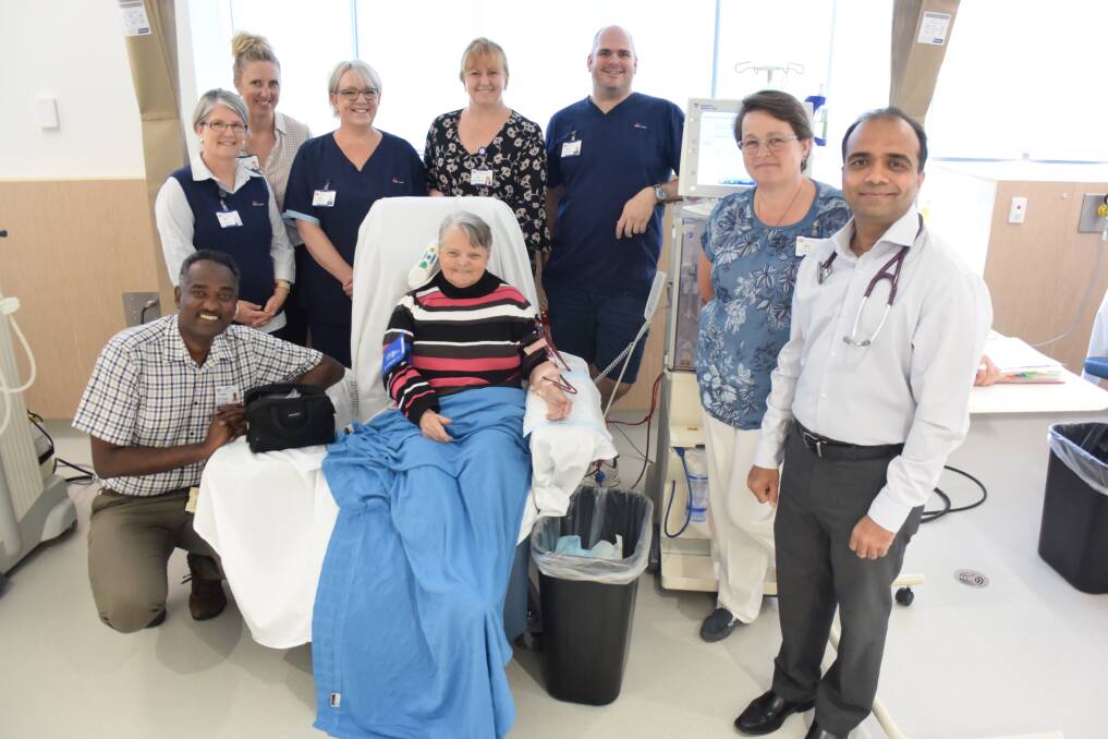 New home: Clinical services director Dr Osama Ali, renal nursing unit manager Leanne Kelly, Lower Mid North Coast sector director of nursing and midwifery Sue Arber, endorsed enrolled nurse Tania Griffis, patient Helen Lawson, Manning Hospital general manager Jodi Nieass, registered nurse Pete Vlahovic, renal nurse practitioner Kris Bentley and renal physician Dr Purvish Patel. Photo: Rob Douglas.  