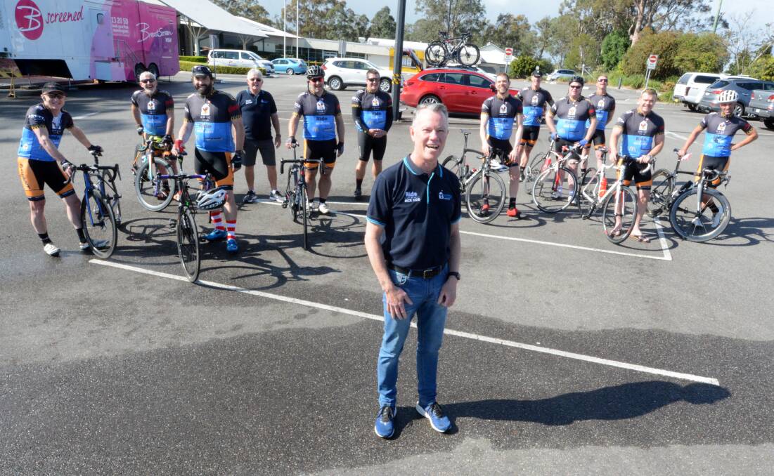 Ronald McDonald House Charities Northern NSW chief executive Ross Bingham with the Ride for Sick Kids team. The crew battled rain and headwinds this week. Photo: Scott Calvin.