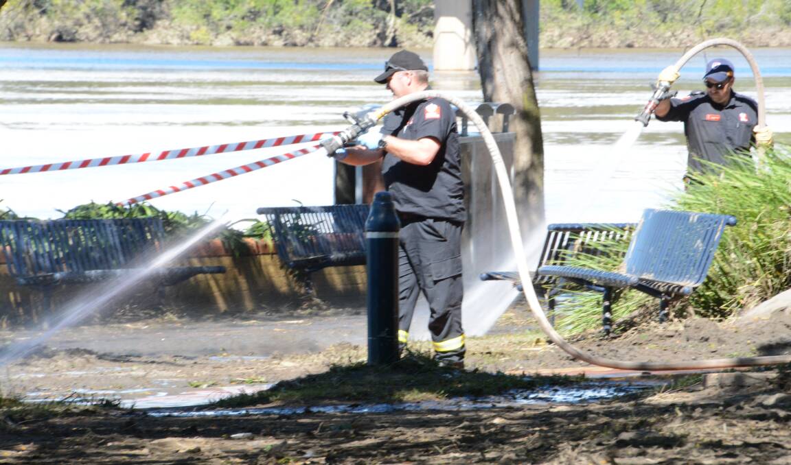 Fire and Rescue NSW crews helped with the clean-up near the former council chambers.