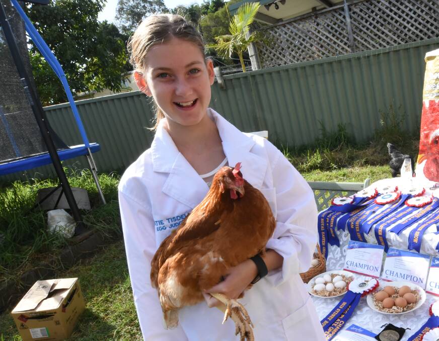 Katie, with her dad Peter, will judge the egg competition at next month's Taree-Wingham Poultry Club show. Photo: Scott Calvin. 