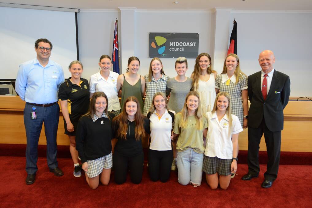 MidCoast Council general manager Adrian Panuccio and mayor David West with members of Taree High School's State girl's hockey championship side. Photo Scott Calvin.