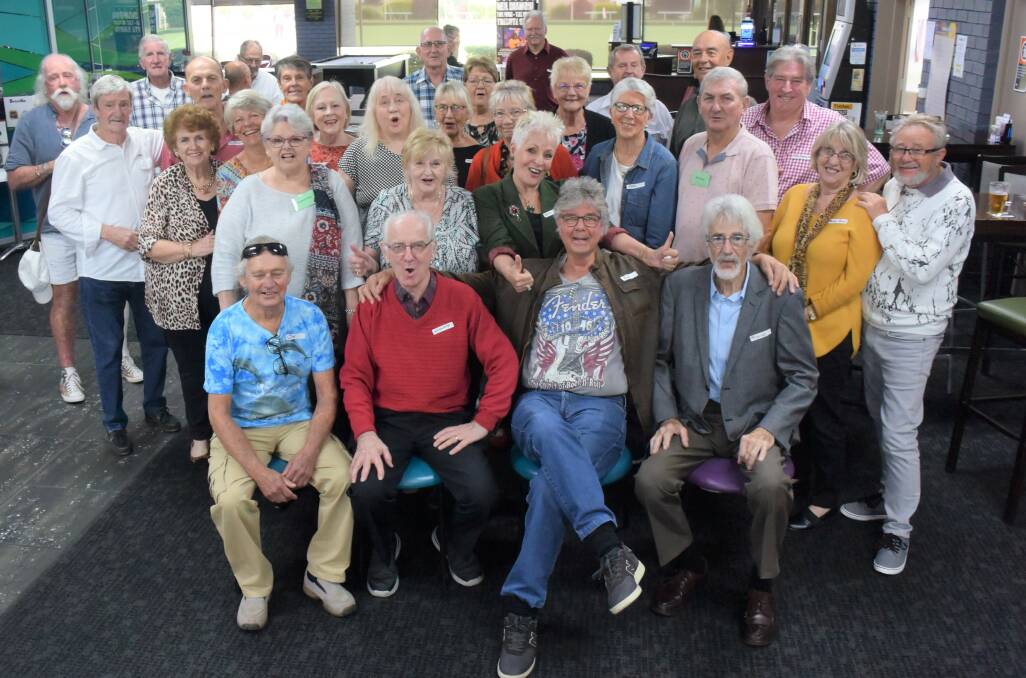 Rick Pointon (sitting second from the right) met up with old friends for the first time in decades at the book launch at Club West. Photo: Rob Douglas.