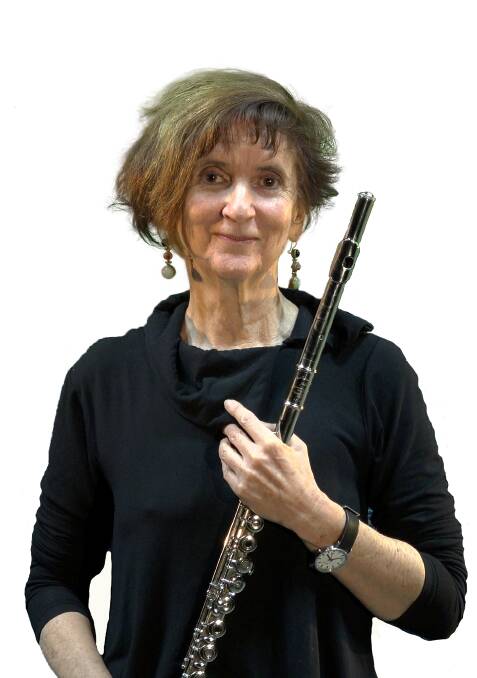 Carla with her beloved flute. Taree police are looking into the theft of her items. Photo: supplied.