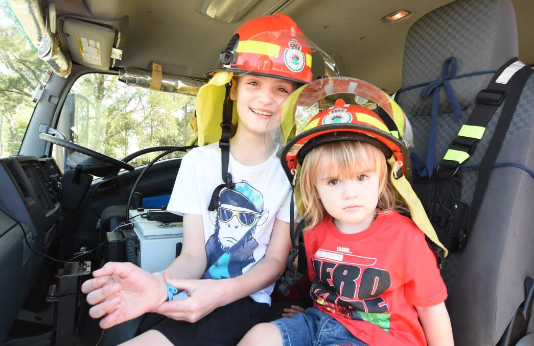 Prepared: Ashton and Cannan Crawford inside a fire truck at the Coopernook RFS Get Ready Weekend event in 2018. Photo: Scott Calvin.