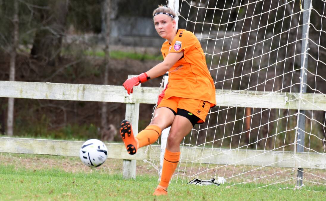 Goalkeeper Maddie Newman clears the ball for FMNC in a clash with New Lambton in Taree last season. The newly named Mid Coast FC will feature in the Herald Women's Premier League in 2020.