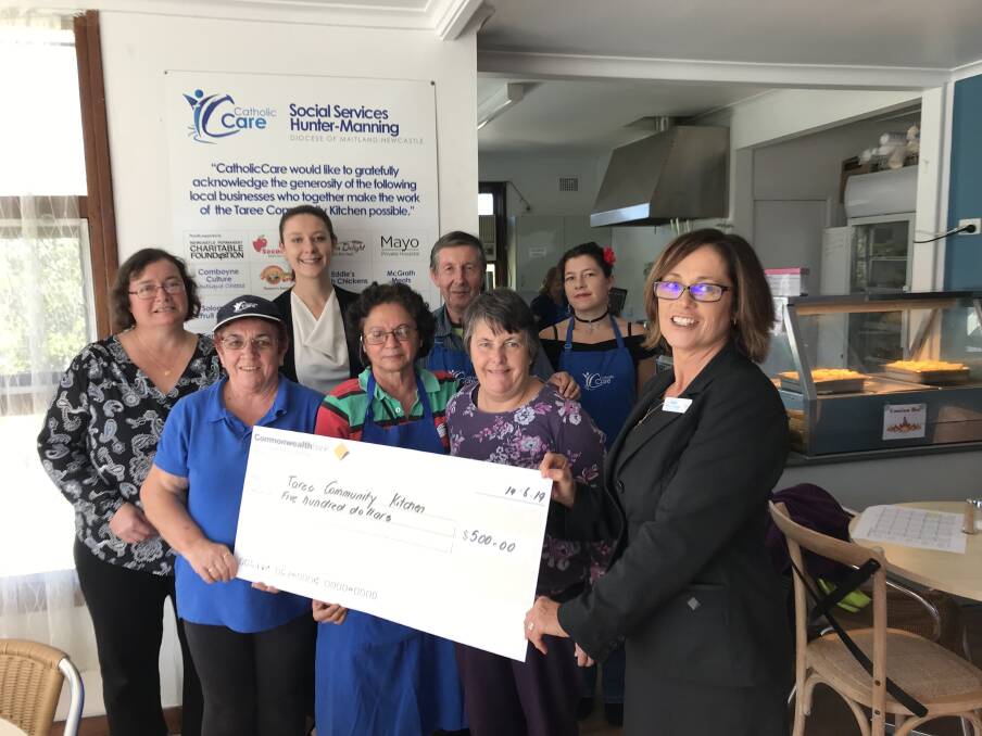 Jenny Hook and Courtney Mobbs, from the Commonwealth Bank's Taree branch, presented the donation to Taree Community Kitchen staff. Photo: supplied.