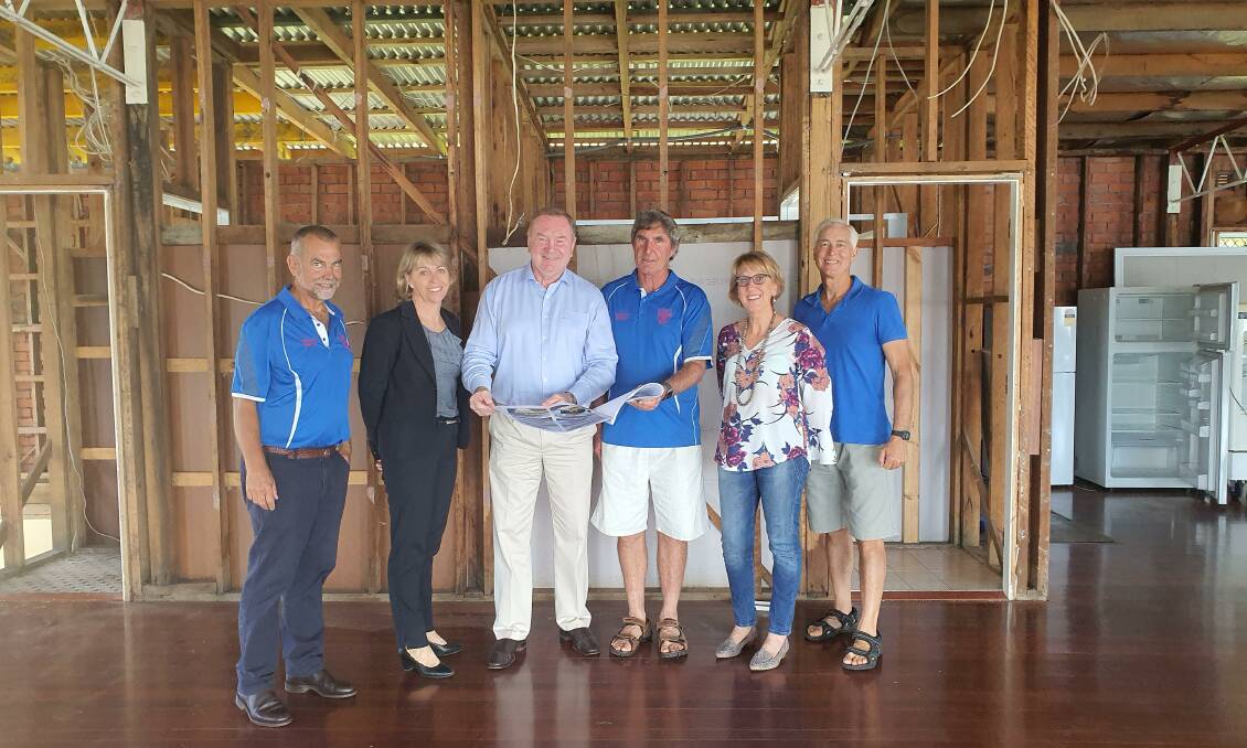 Member for Myall Lakes Stephen Bromhead with club members at the soon to be rebuilt Manning River Rowing Club clubhouse.