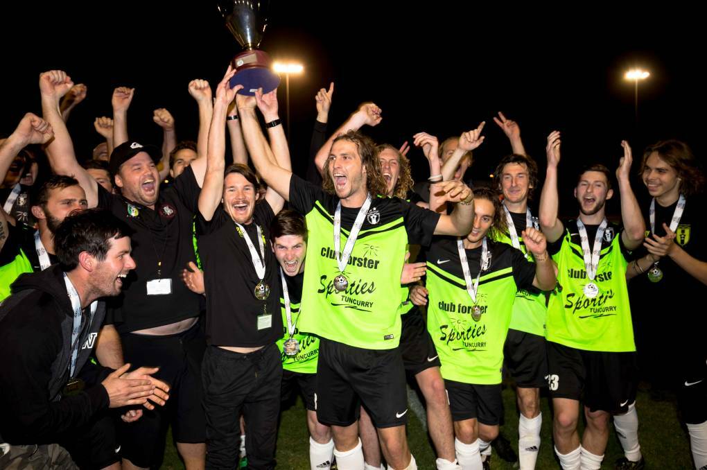 One more match: Wallis Lake celebrate after last year's title win over Port United. Will they add another title this Saturday? Photo: Ivan Sajko.