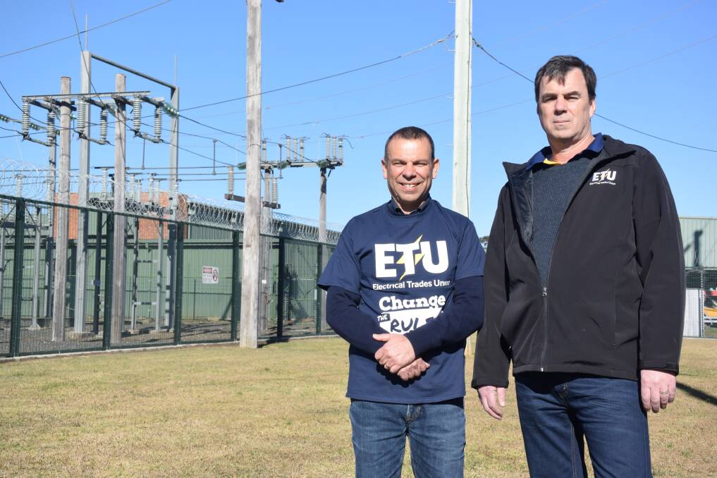 A push for change: Electrical Trade Union's Mark Buttigieg and Dave McKinley outside of Essential Energy's site at Whitbread Street, Taree. Photo: Rob Douglas. 