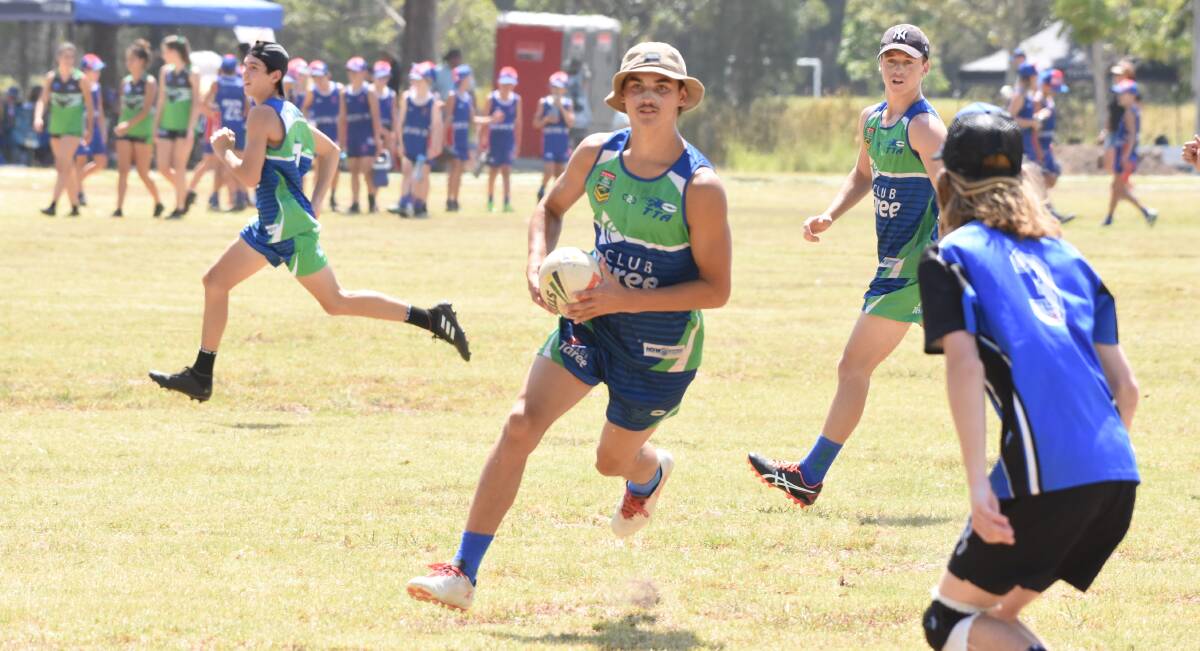 Quick heels: Jarrad Gibson runs the ball up for the Flames under 18s boys side at the Northern Eagles Junior Touch Football Championships held in Taree in January. Photo: Scott Calvin. 