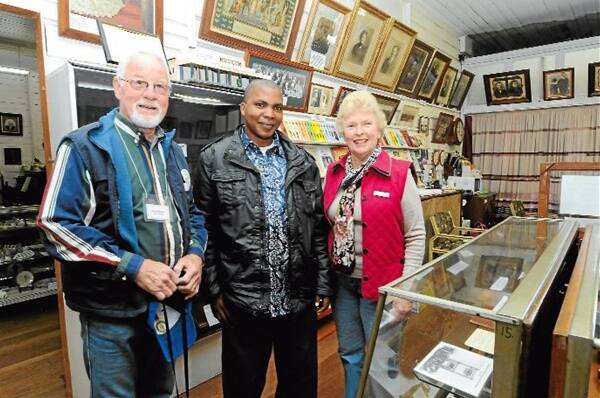 History lesson: Ron Hindmarsh and Barbara Waters from the Manning Valley Historical Society welcomed the visitors to the Wingham Museum on Saturday morning. They are pictured with Emmanuel Moira in the museum.
