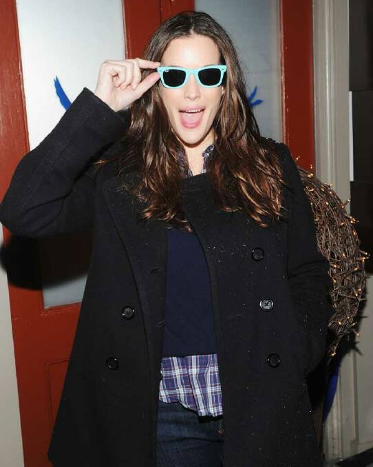 Liv Tyler proves that butter wouldn't melt, perking up a winter outfit with a blast of sunny style.