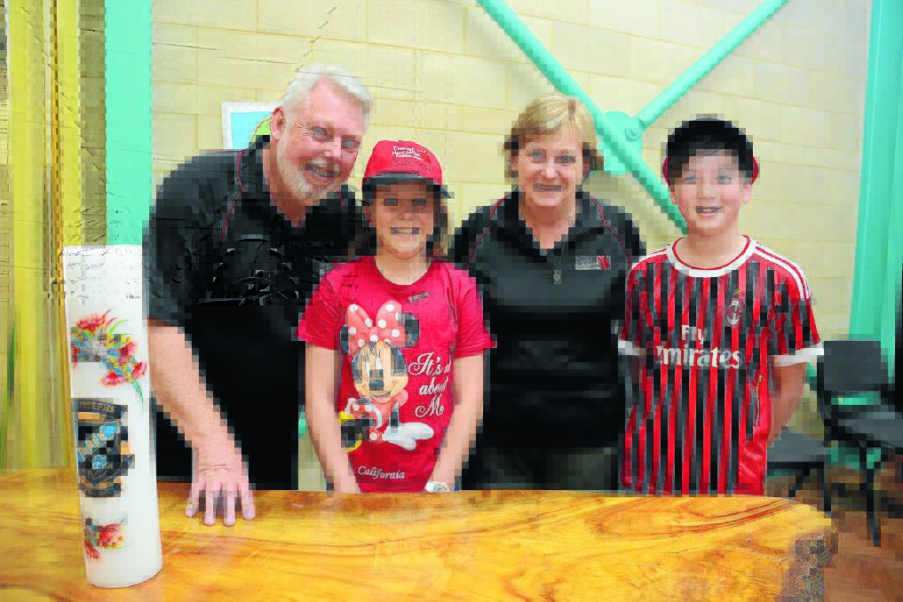 Bruce and Denise Morcombe and Isaac Cross and Cayley Cribb from St Josephs Priimary School.