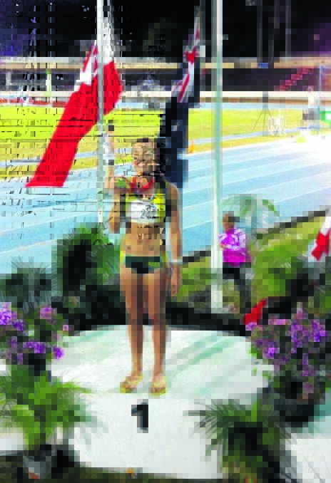 Flag bearer: Former Old Bar athlete Elana Withnall in Tahiti.
