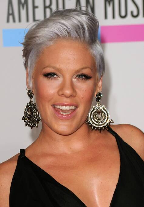 Pink arrives in Sydney - to the delight of local paparazzi.