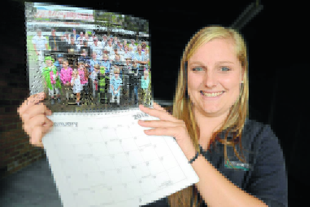 Manning Dairy Youth secretary, Emma Polson with the group's new 2014 calendar, which is being sold as a fundraiser.