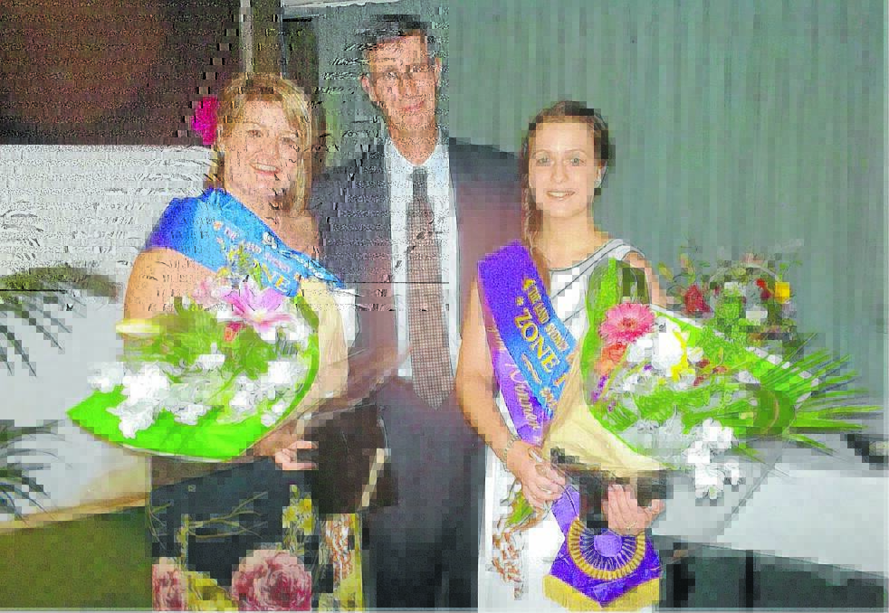 Tayla Maloney and Melanie Loomes are congratulated by judge Andrew Marshall from The Land Newspaper.