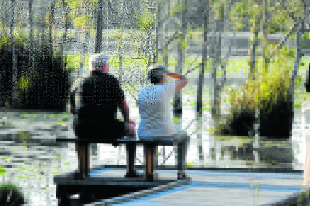 Bruce and Wendy Halpin of Tuncurry enjoy breakfast with the birds at Cattai Wetlands this week.