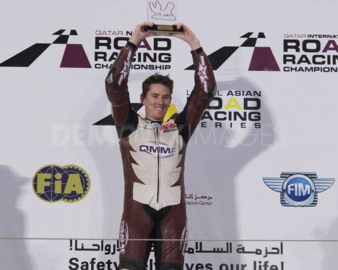 Alex Cudlin celebrates his third win the Qatar Road Racing championship.