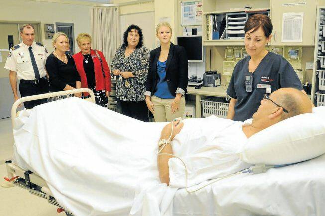 Intensive care paramedic Steve Martyn, clinical leader of Hunter New England Health’s stroke team Louise Jordan, past district governor of Quota Jan Irvine, stroke care coordinator Jenny Rudd, medical student from John Hunter Hospital Claire Sewell and nurse Renee Phegan with patient Michael Hamming.